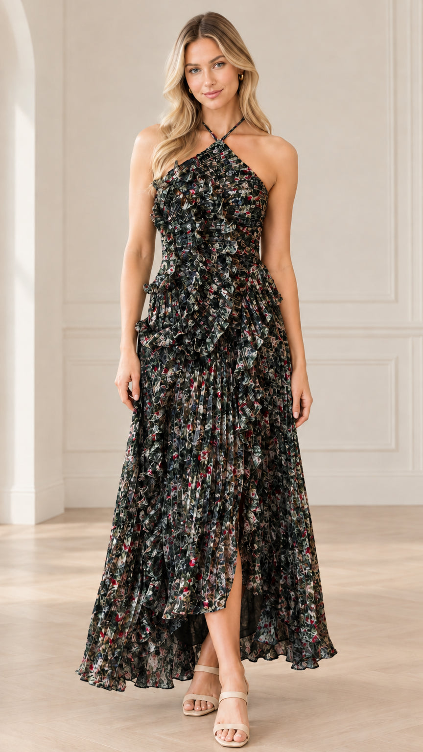 Front full-length view of model wearing black floral halter neck pleated maxi dress
