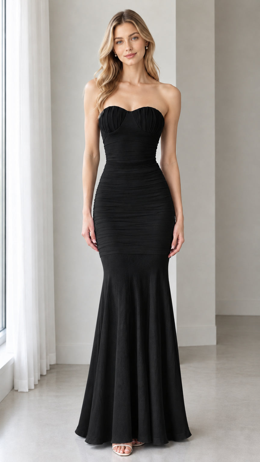 Front full-length view of model wearing the classic Black strapless ruched mermaid maxi dress
