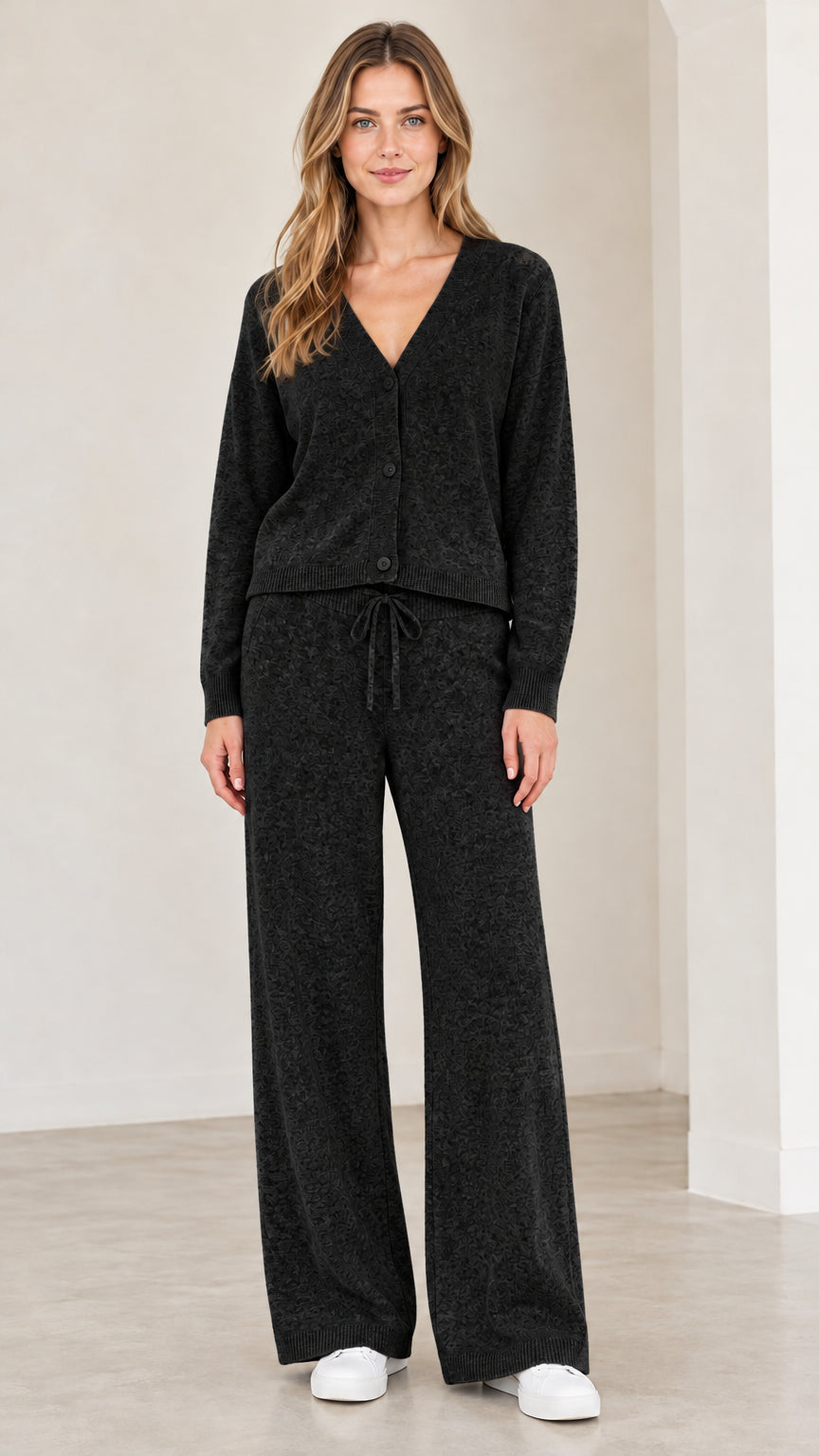 Front full view of woman wearing black knit cardigan and wide leg lounge set