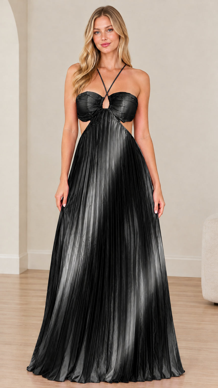 Front view of model wearing solid black pleated halter cutout maxi dress