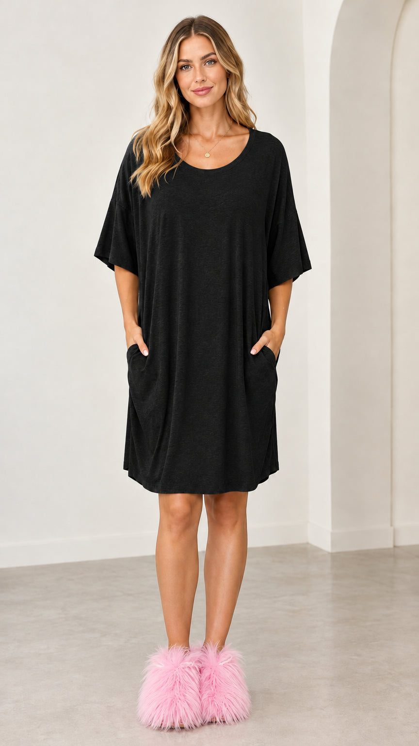 Full front view of the black oversized short sleeve lounge dress with pockets