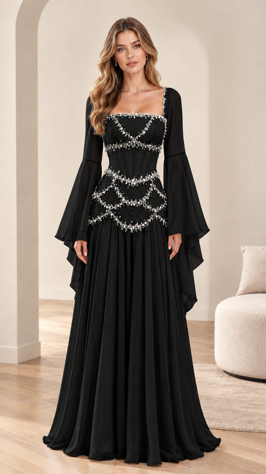 Model wearing black pearl-embellished Renaissance maxi dress with dramatic bell sleeves