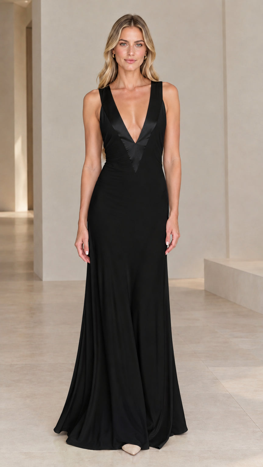 Front view of model wearing black sleeveless plunging V-neck formal evening gown