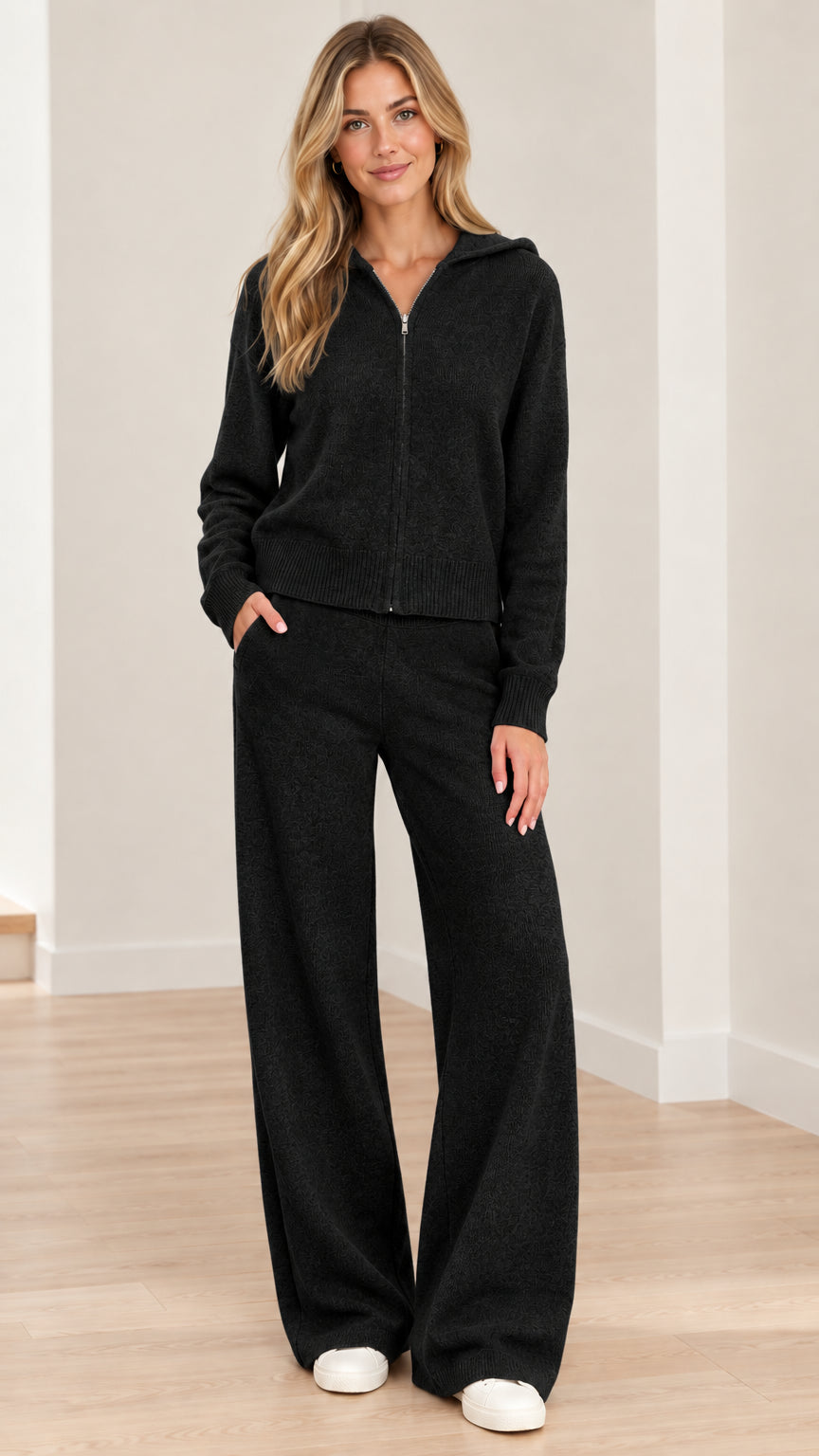 Full front view of model wearing Black knit zip-up hoodie and wide-leg pants set