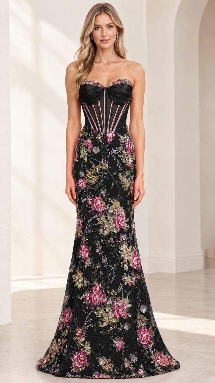 Front view of woman wearing black strapless corset gown with colorful floral embroidered skirt