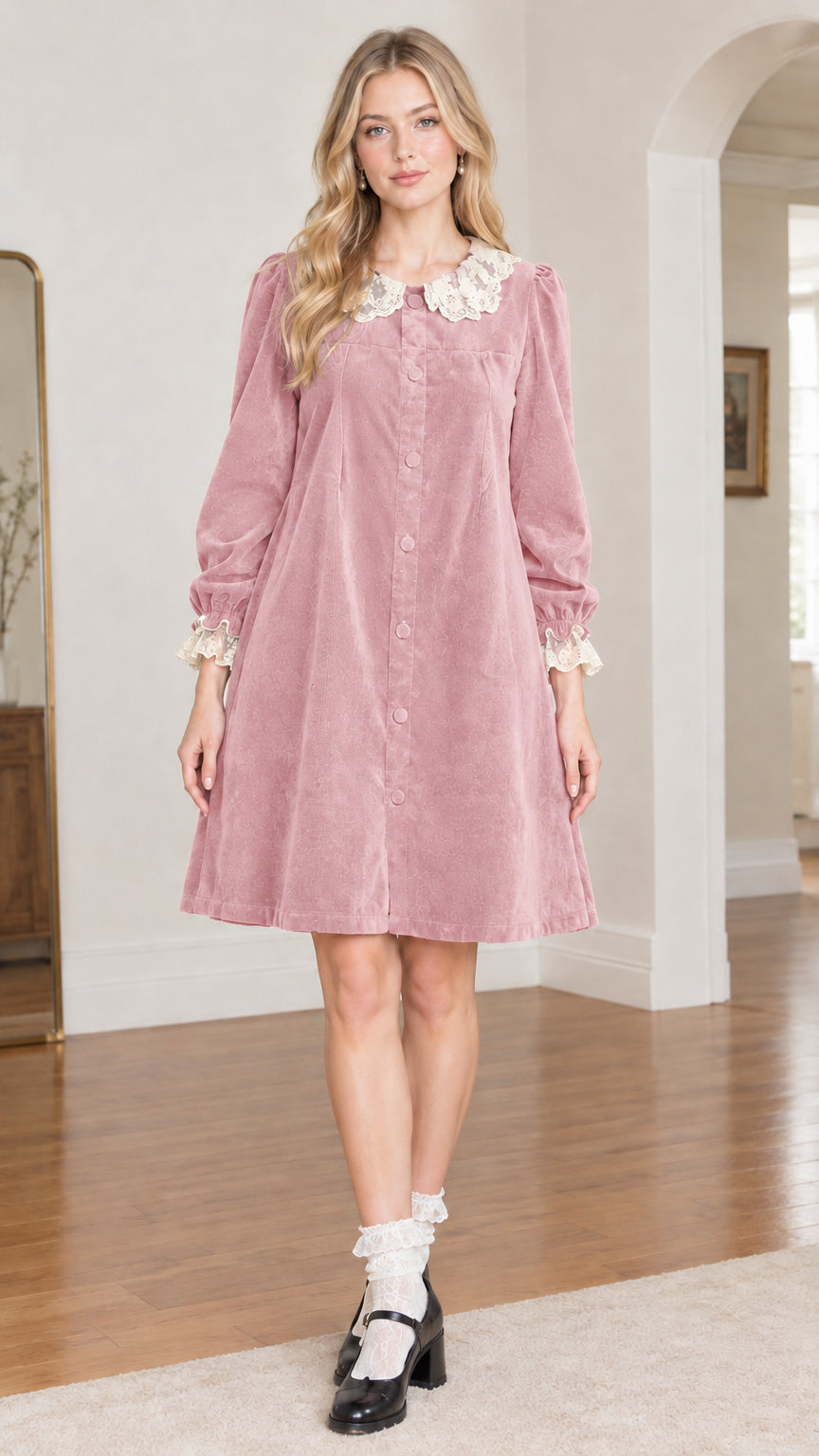 Front view of model wearing dusty pink velvet babydoll dress with lace collar