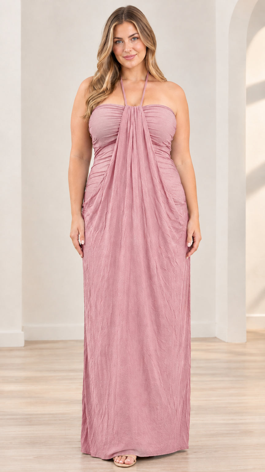 Front full-length view of model wearing dusty rose halter draped maxi dress