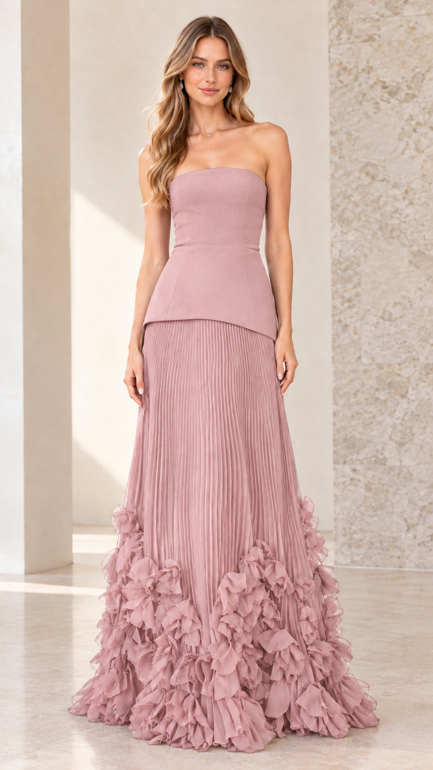 Front view of model wearing dusty rose strapless peplum pleated evening gown