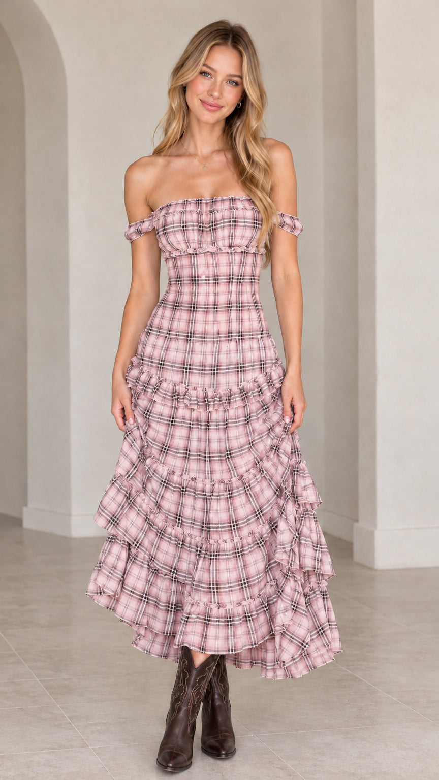 Model wearing pink plaid off-the-shoulder tiered maxi dress