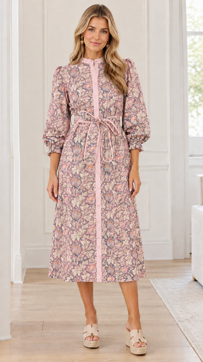 Front view of woman wearing dusty pink floral print button-front midi dress