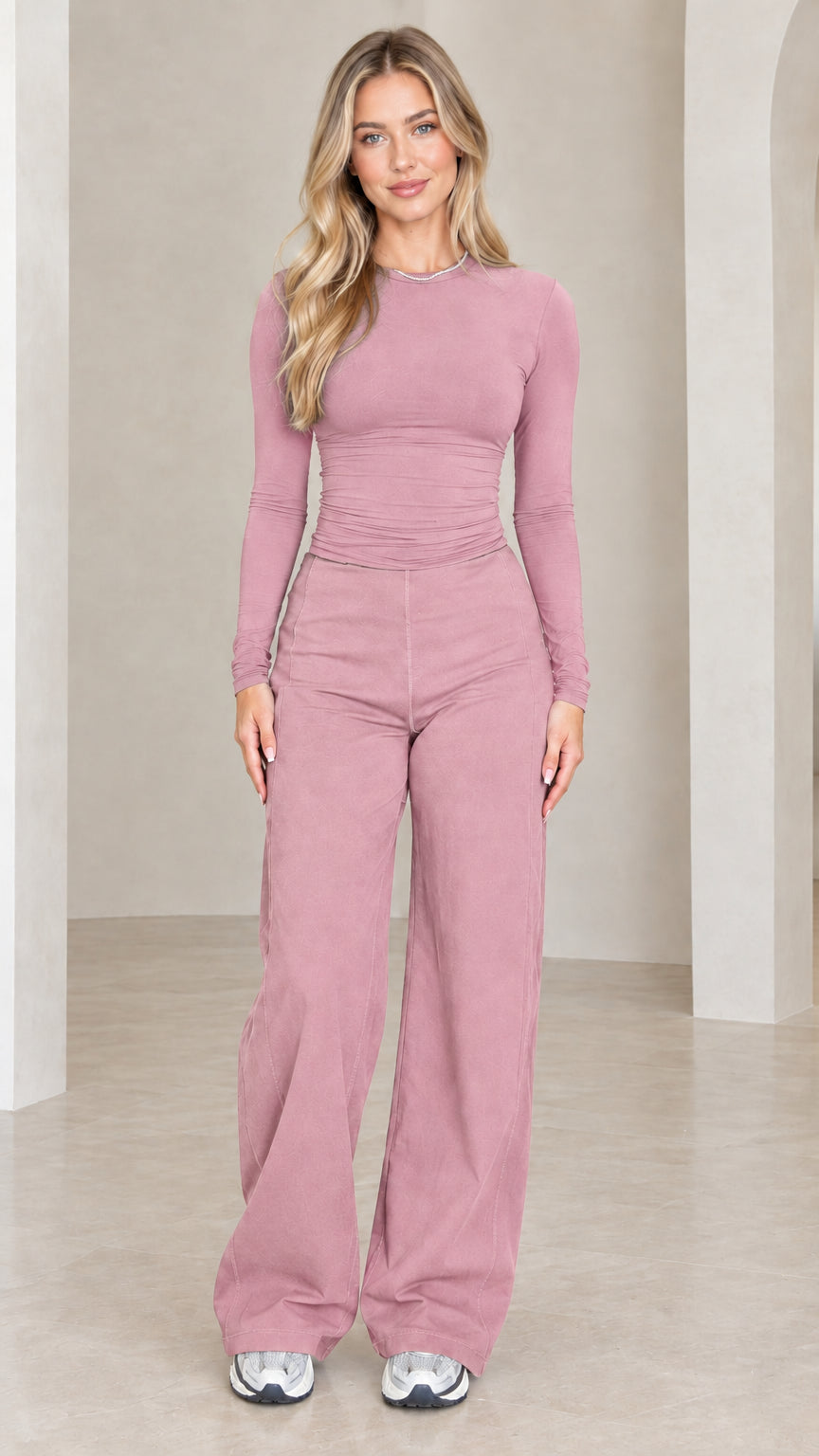 Front full length view of model wearing dusty pink ruched top and wide leg pants set
