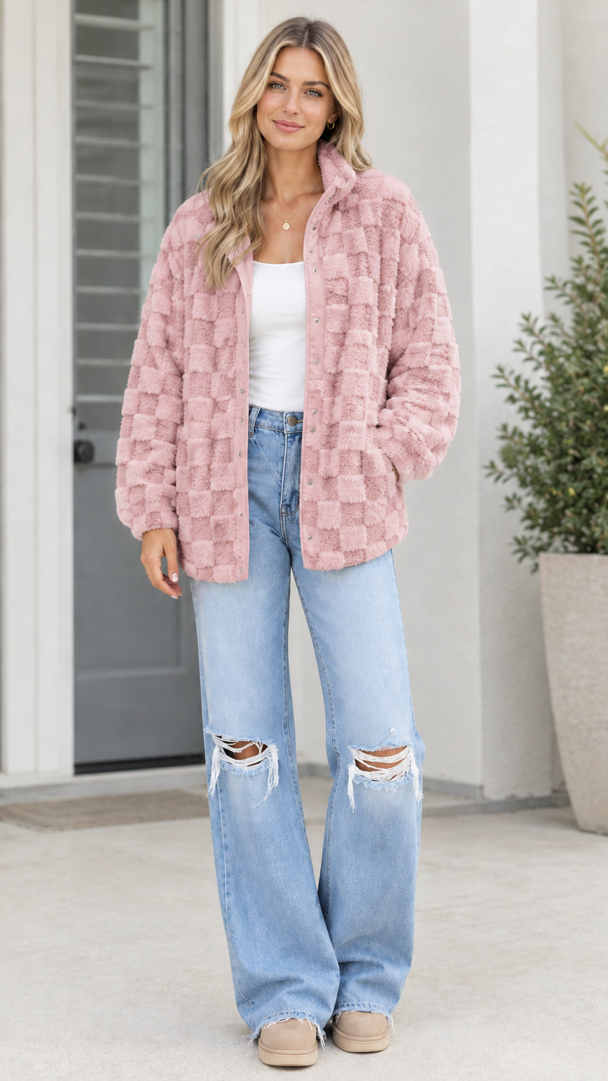 Model wearing dusty pink textured checkerboard plush fleece jacket