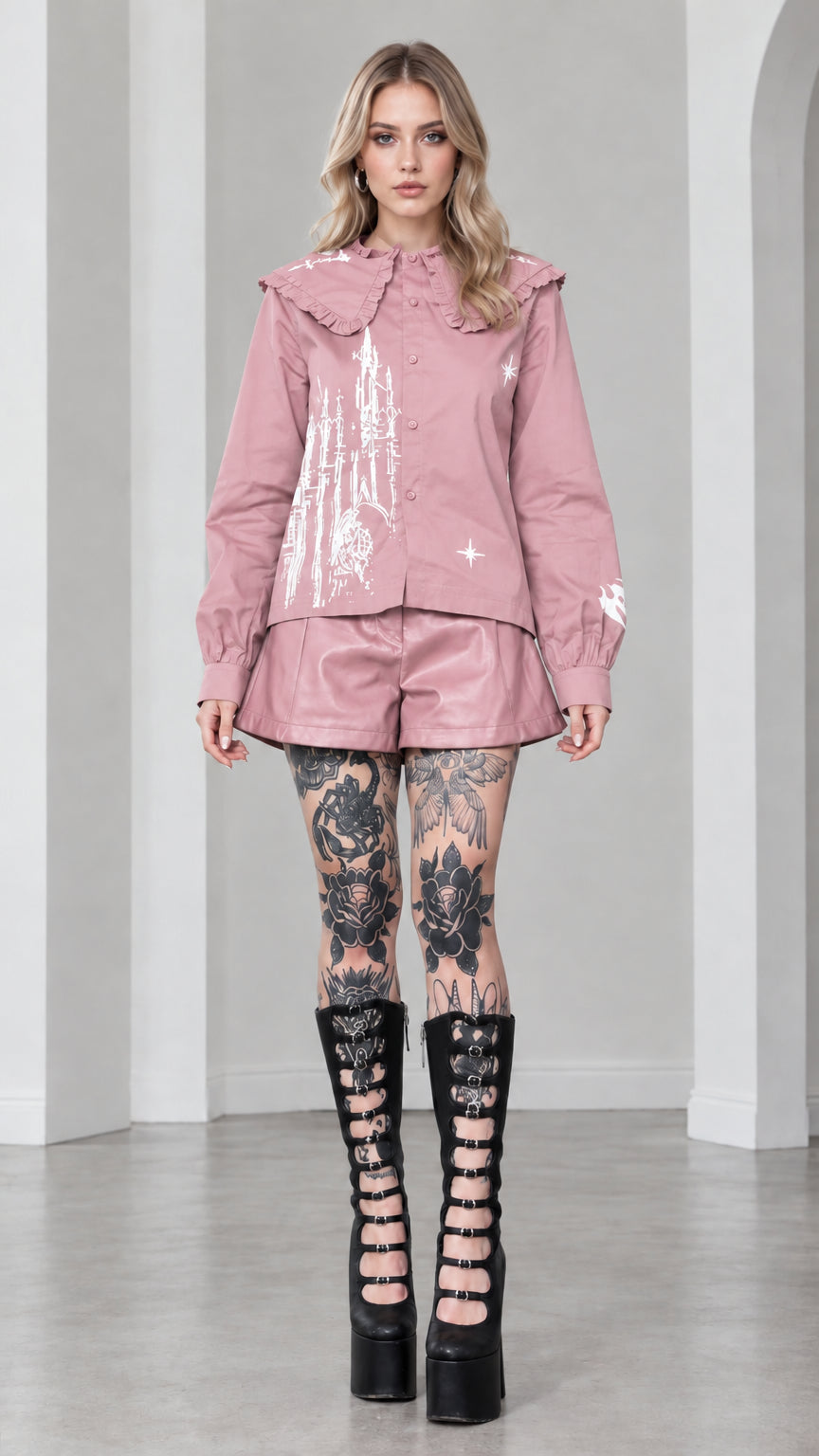 Full front view of model wearing dusty pink gothic castle print ruffled collar blouse
