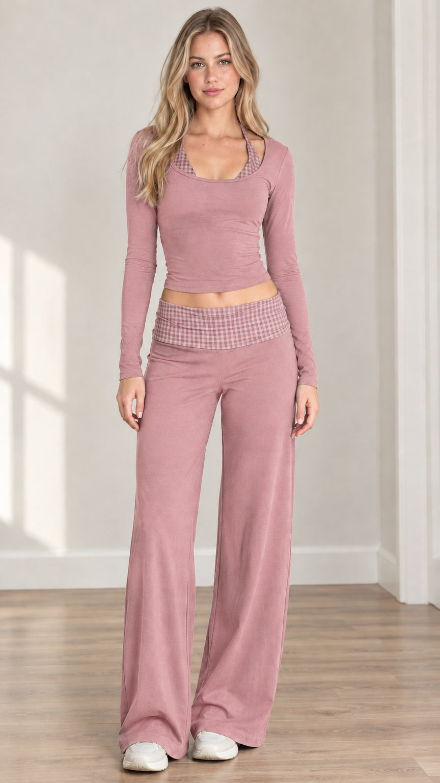 Front view of woman wearing dusty pink long sleeve crop top and matching wide leg lounge set