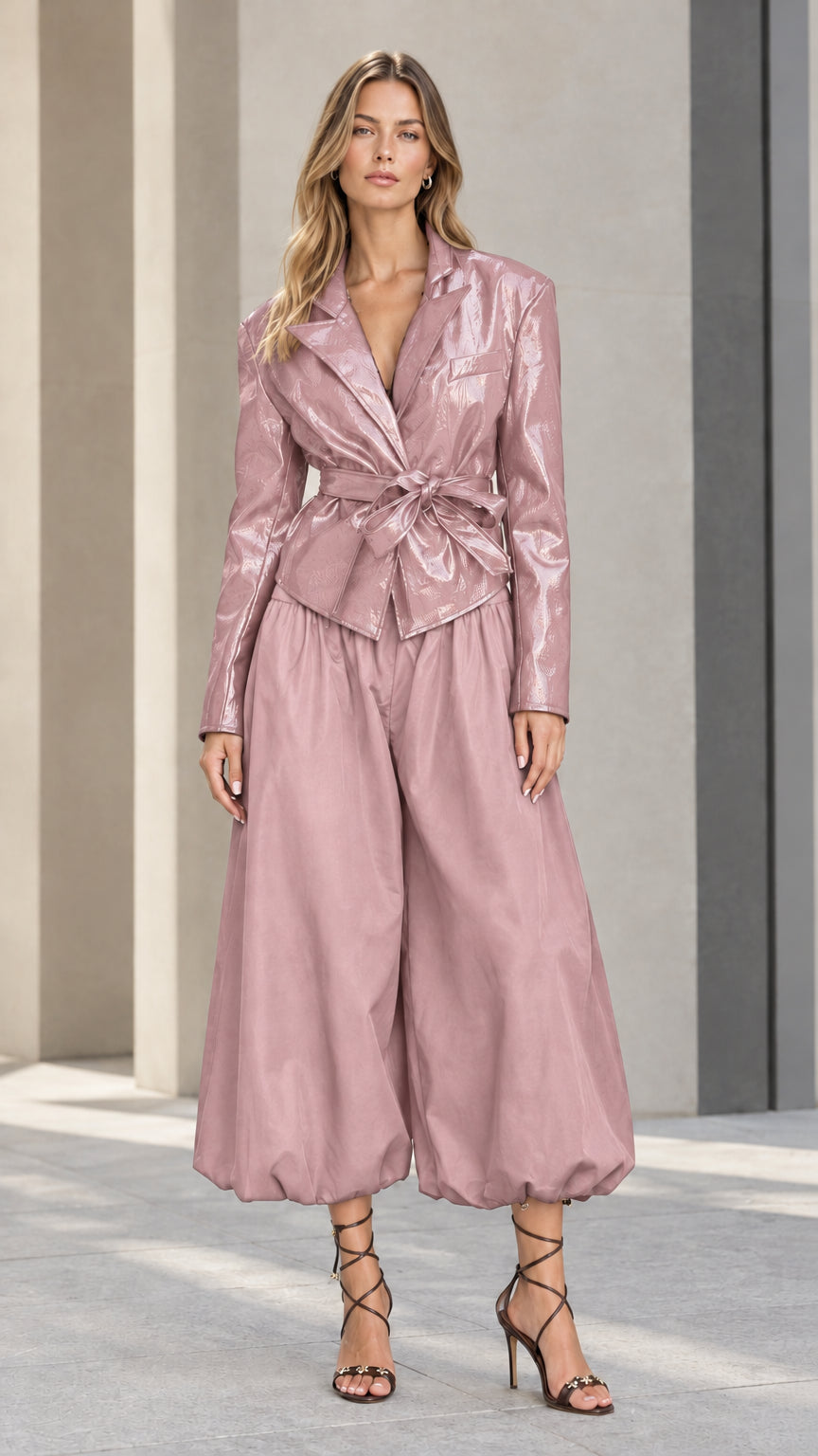Front view of model wearing dusty pink high-shine blazer and matching balloon culotte pants