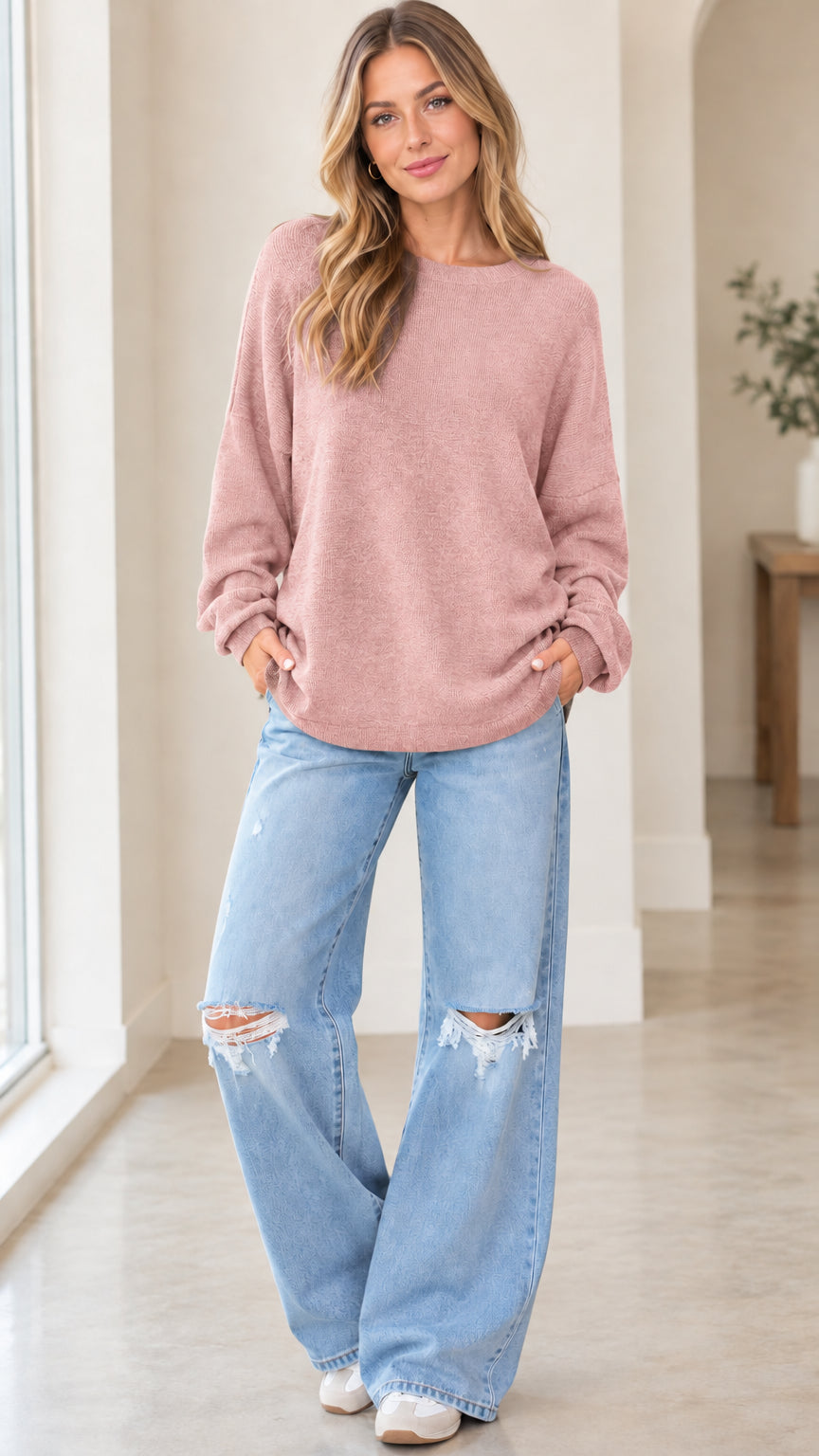 Front full view of woman wearing dusty pink long sleeve crewneck knit pullover sweatshirt