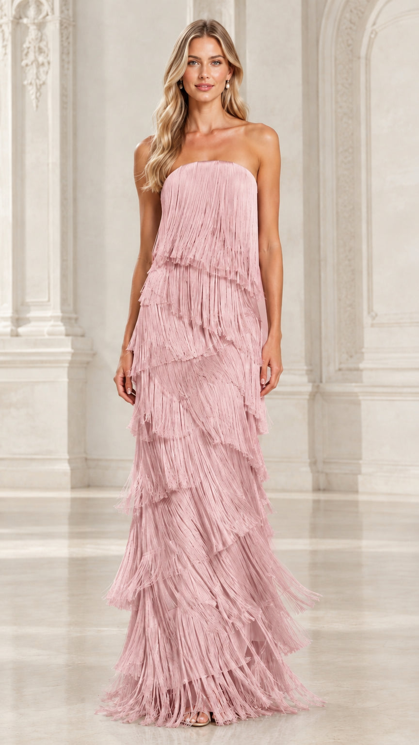 Front view of model in dusty pink strapless tiered fringe maxi evening gown