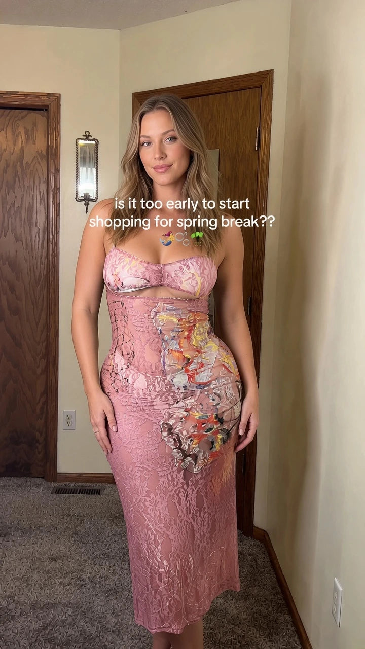 Front view of model wearing Blush Pink strapless floral lace cutout midi dress
