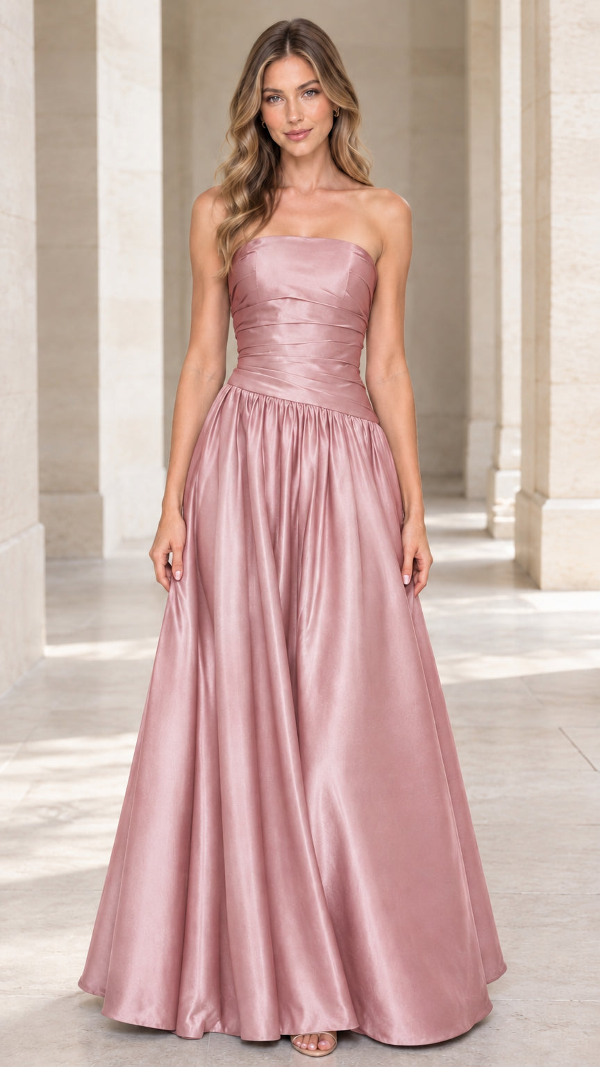Full-length front view of dusty rose pink strapless pleated satin formal maxi dress