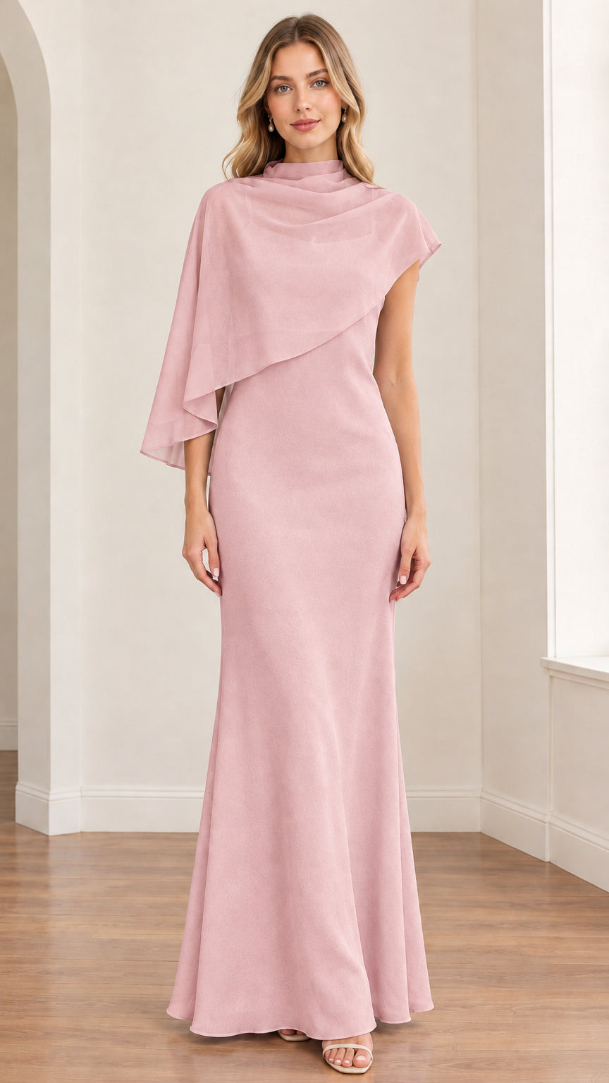 Front view of model wearing the dusty pink asymmetrical capelet evening maxi dress