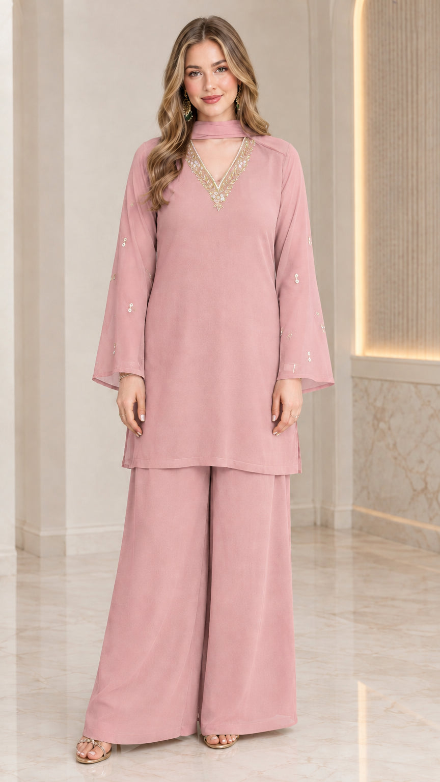 Front full-length view of model wearing dusty pink embellished tunic and wide-leg pant set