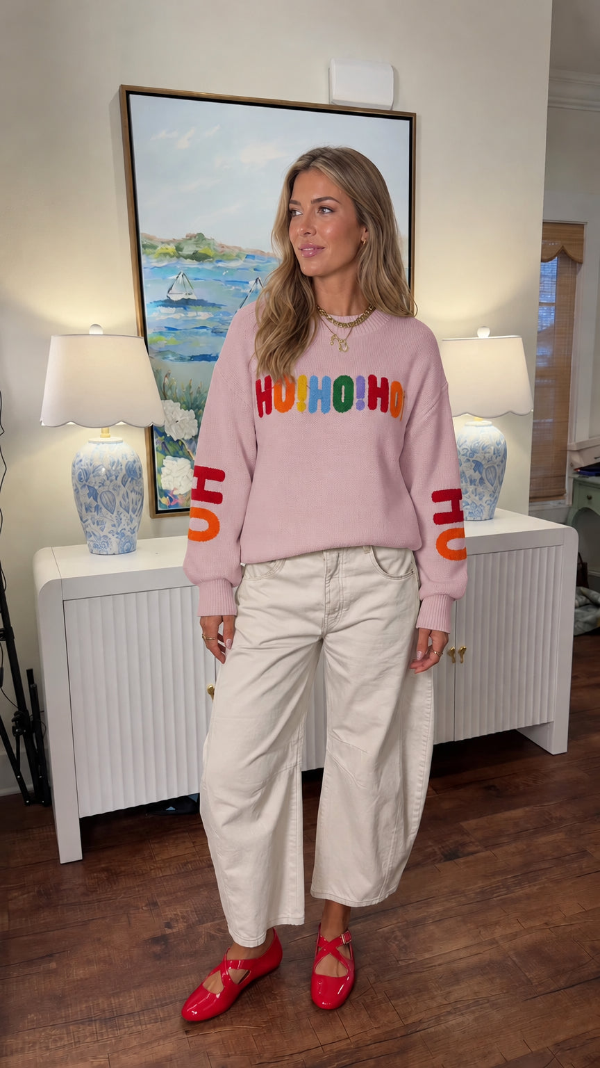 Woman modeling light pink Ho Ho Ho Christmas crewneck sweater