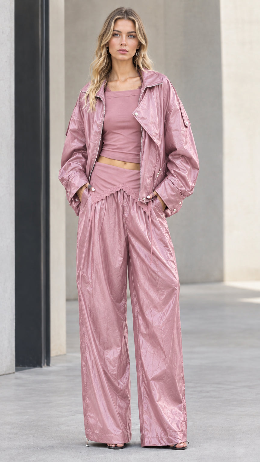 Full front view of model wearing dusty pink crinkle metallic jacket and wide leg pants set