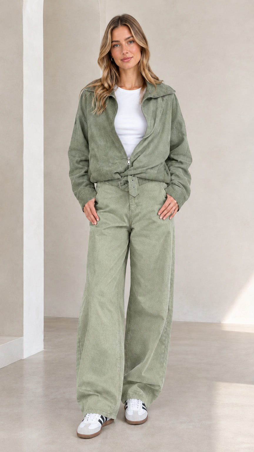 Woman wearing full sage green two-piece utility jacket and wide-leg pants set