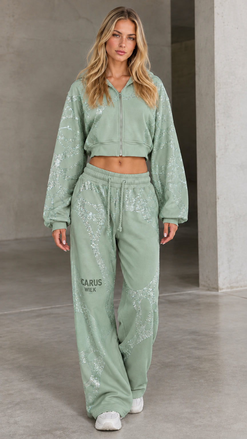 Front view of woman wearing sage green rhinestone cropped hoodie and wide-leg sweatpants set