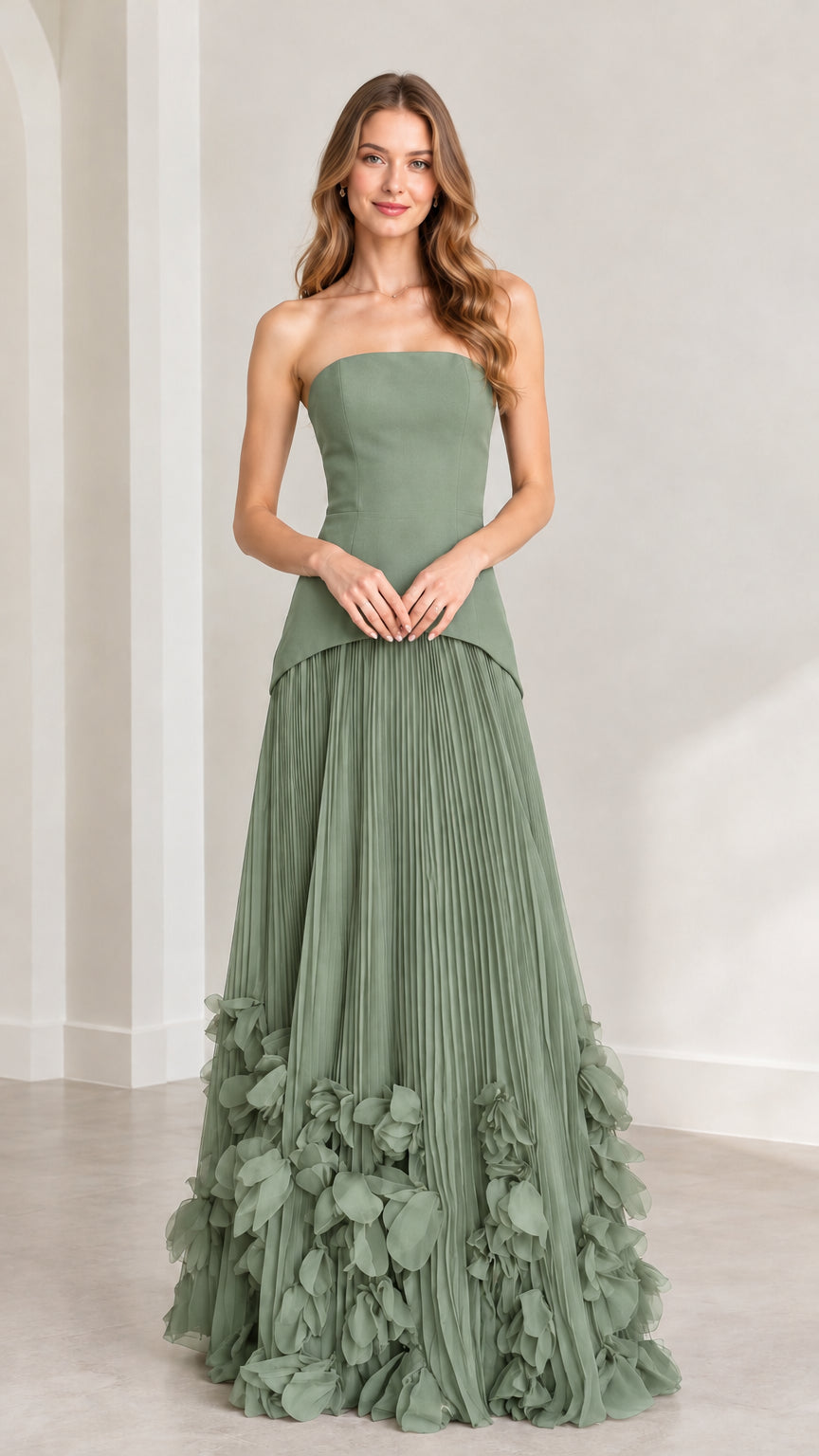 Front view of model wearing sage green strapless pleated maxi dress