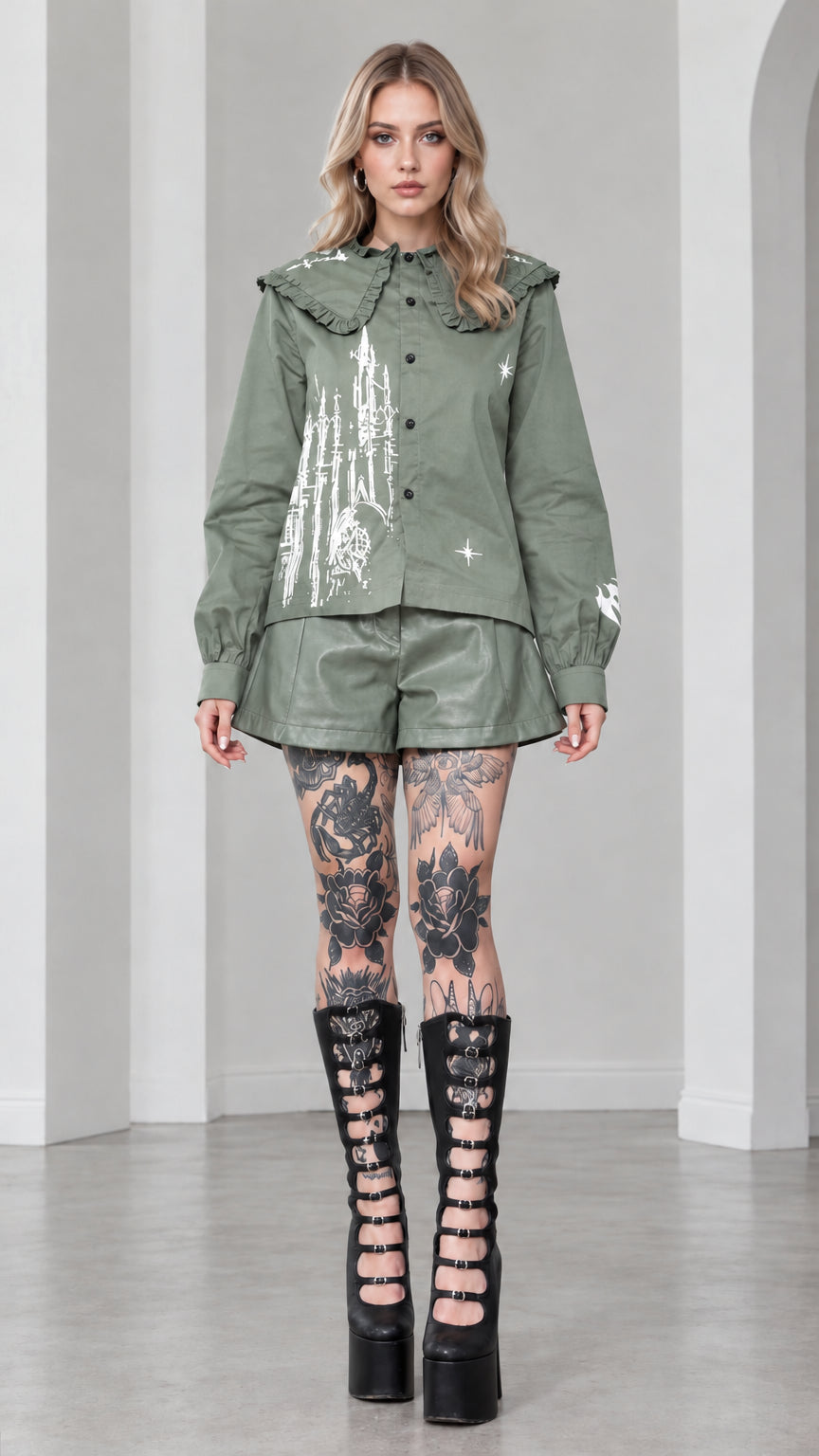 Full front view of model wearing sage green gothic castle print ruffled collar blouse