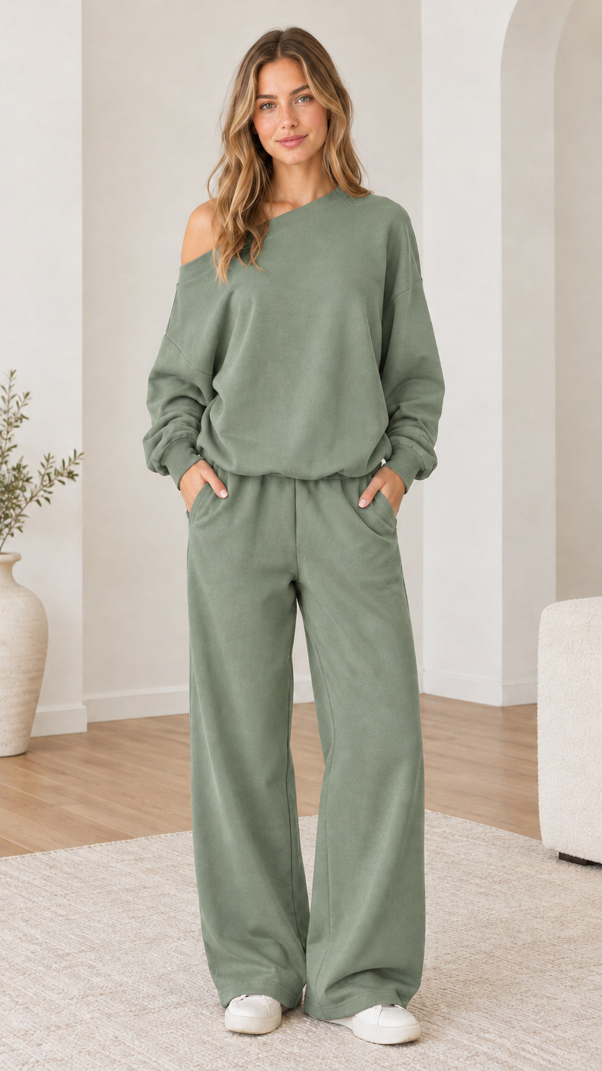 Model wearing sage green one-shoulder sweatshirt and wide-leg sweatpants set