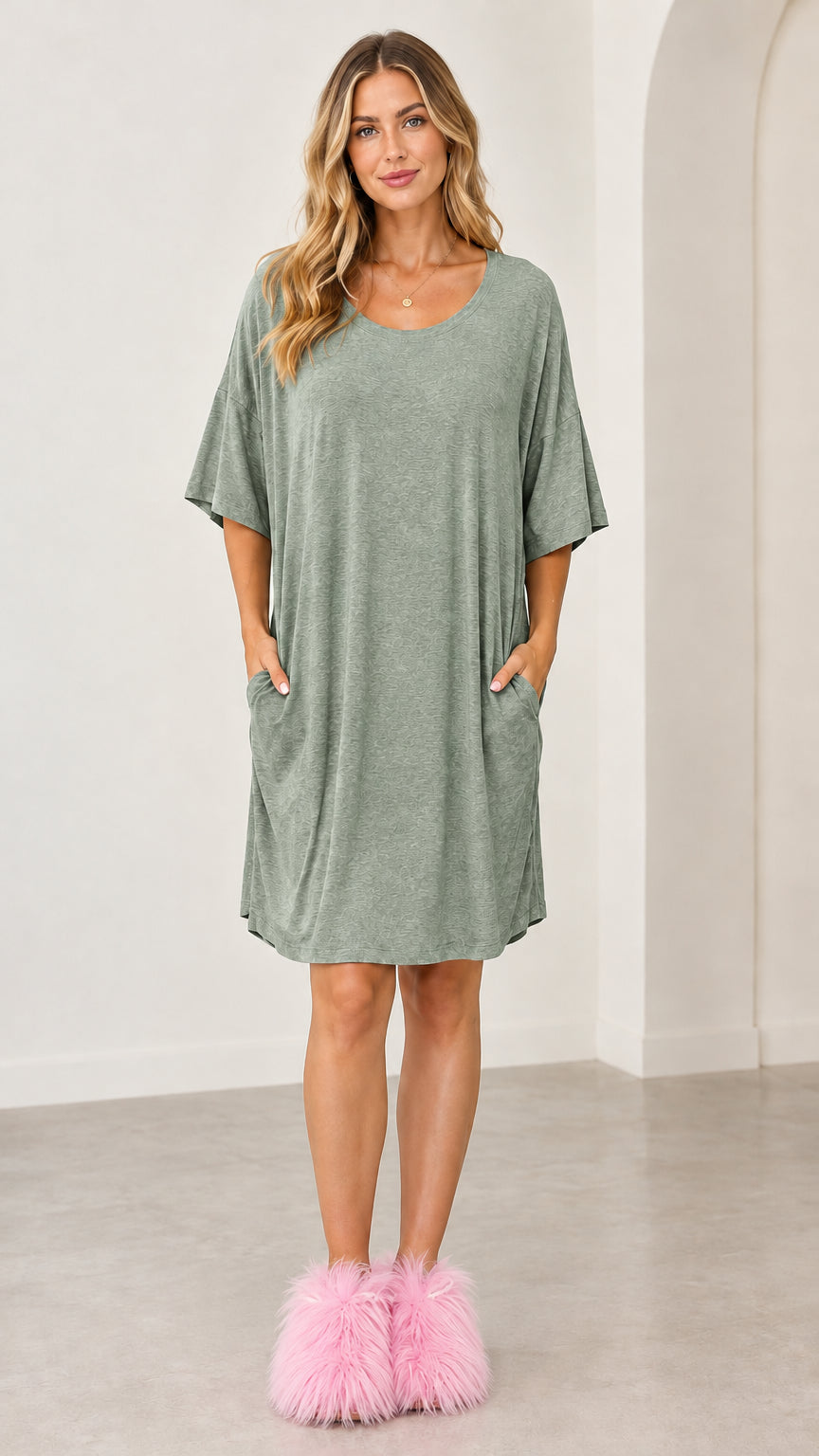 Full front view of the sage green relaxed knee-length lounge dress with pockets