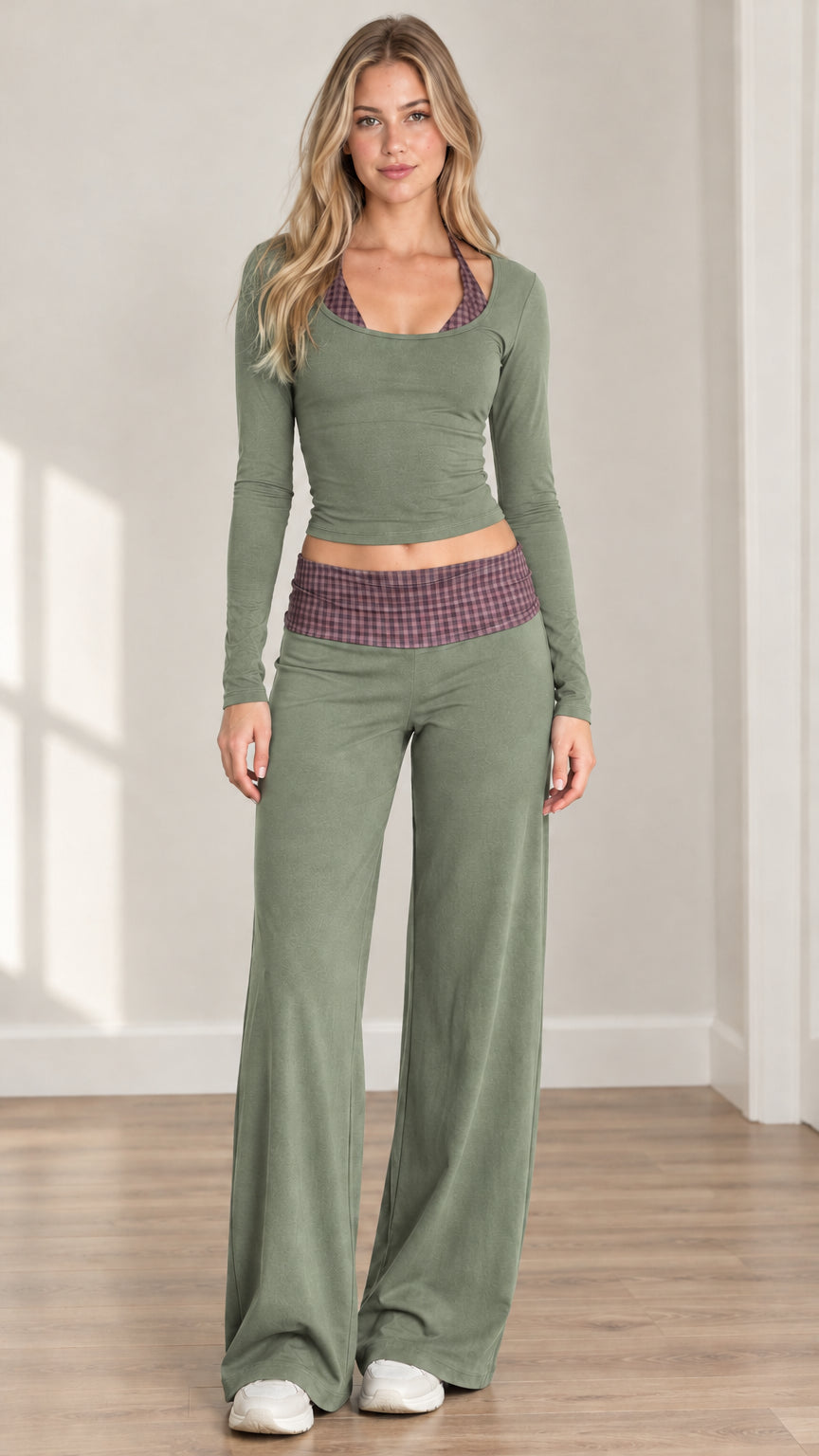 Front view of woman wearing sage green two piece lounge set with check fold-over waistband