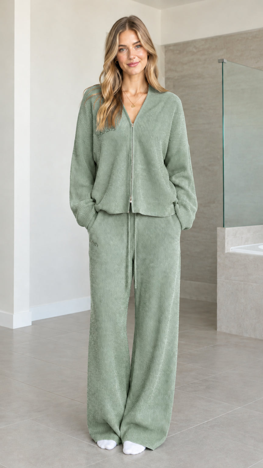 Front view of woman wearing Sage Green ribbed knit zip-up loungewear set