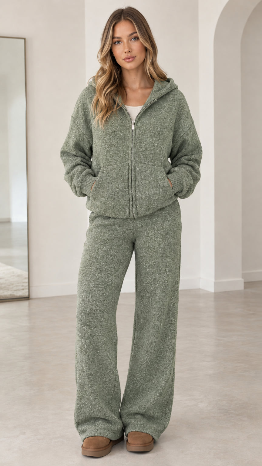 Front full-length view of model wearing sage green textured knit zip hoodie and pants set