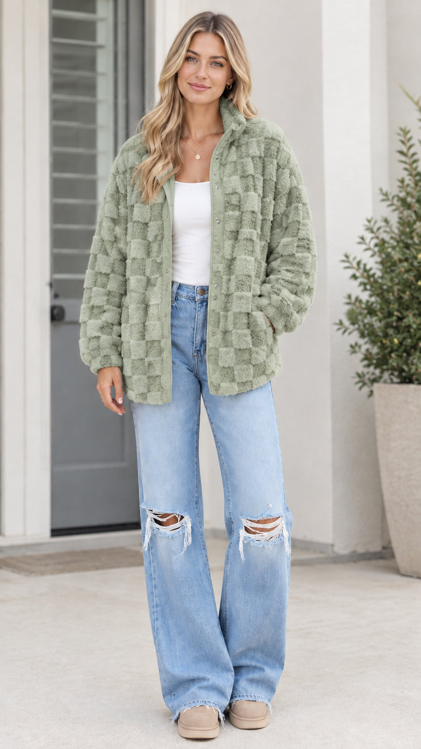 Model wearing sage green textured checkerboard plush fleece jacket