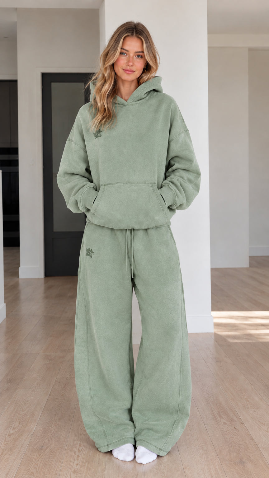 Front view of model wearing Sage Green oversized hoodie and wide-leg sweatpants set