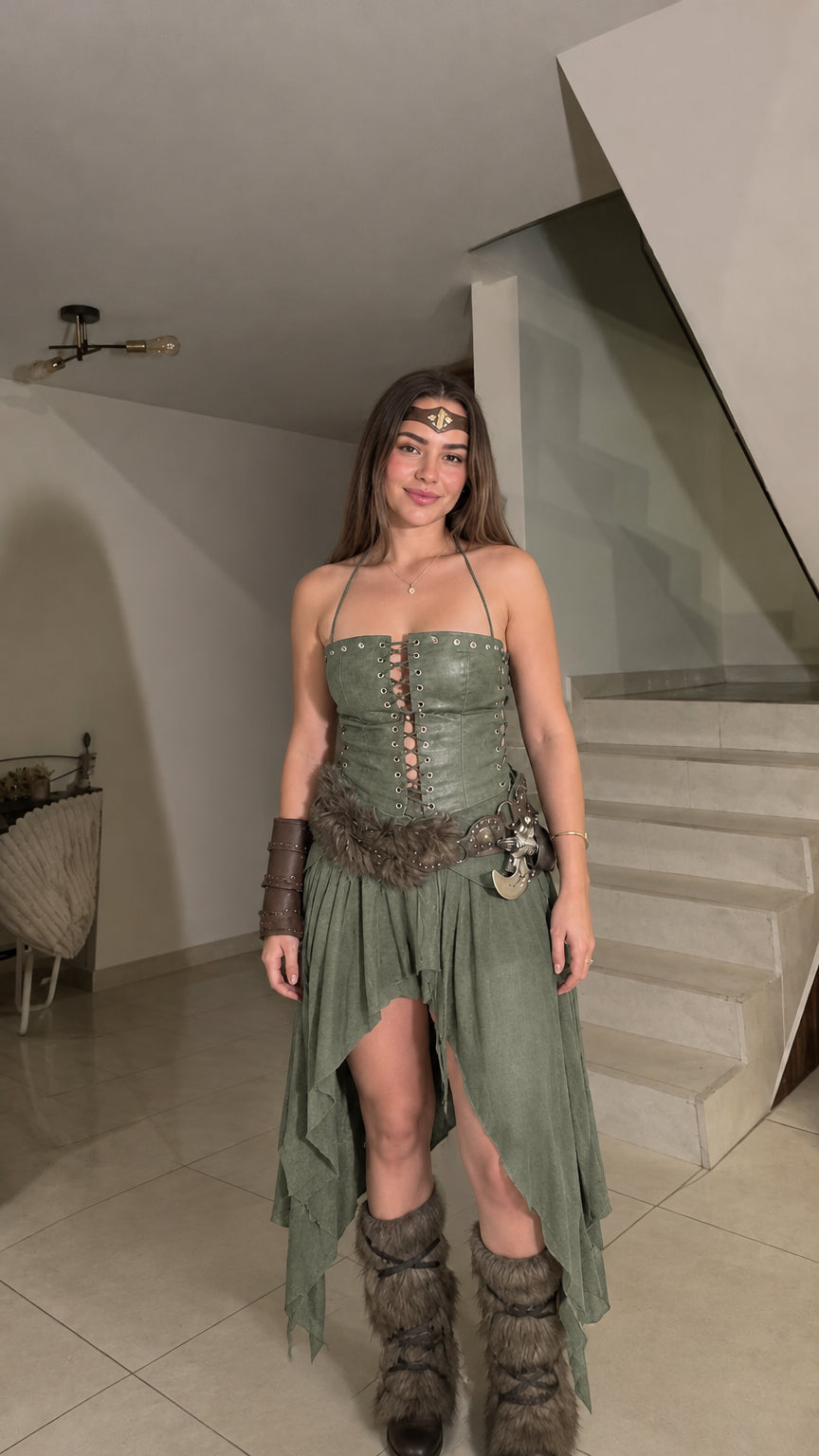 Woman posing in the sage green Viking warrior lace-up corset top and draped handkerchief skirt costume set