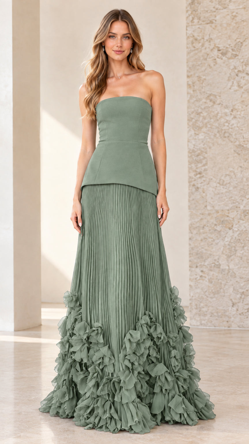 Front view of model wearing sage green strapless peplum pleated evening gown
