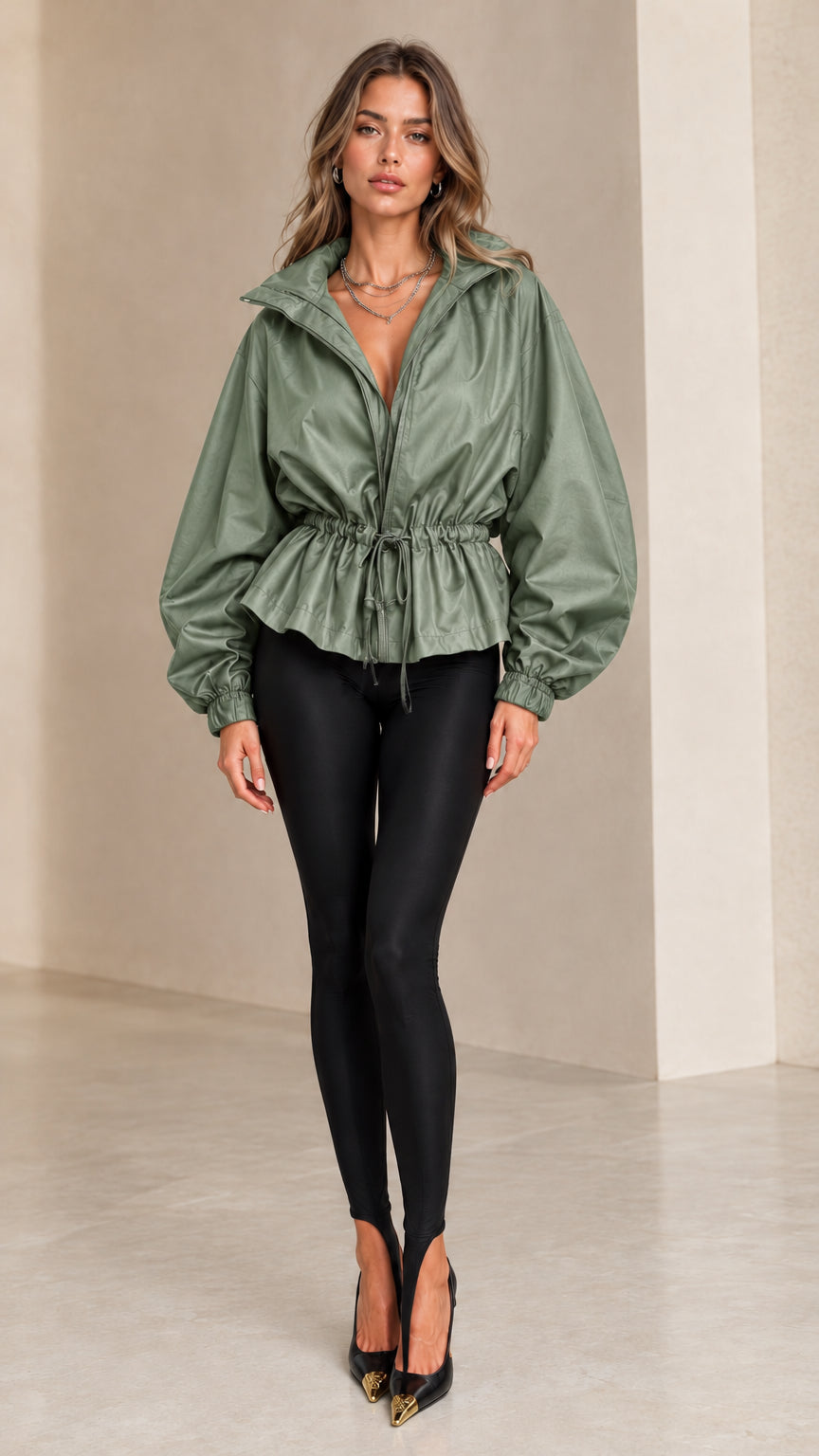 Front view of model wearing sage green drawstring waist peplum jacket
