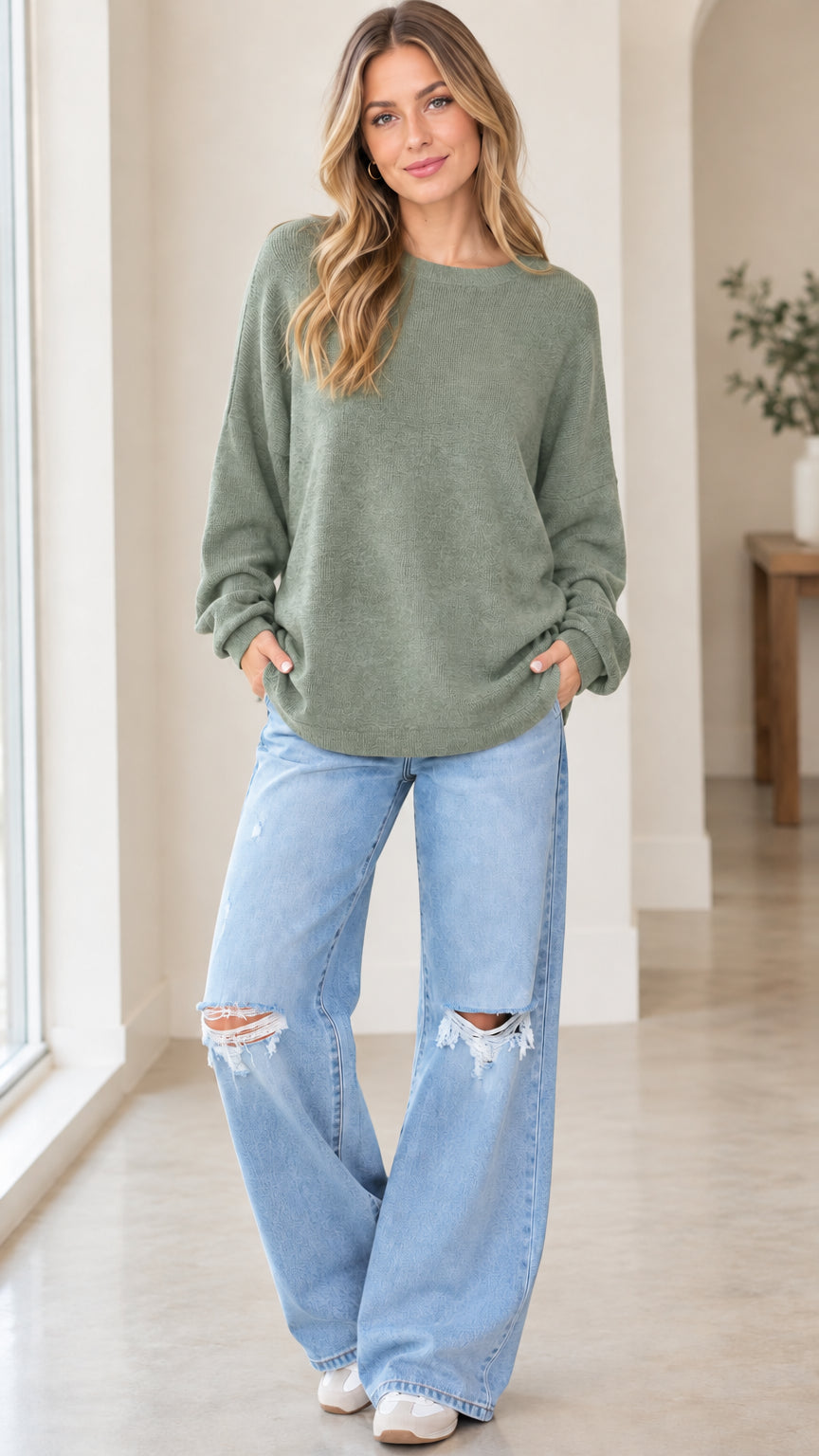 Front full view of woman wearing sage green casual crewneck knit pullover sweatshirt
