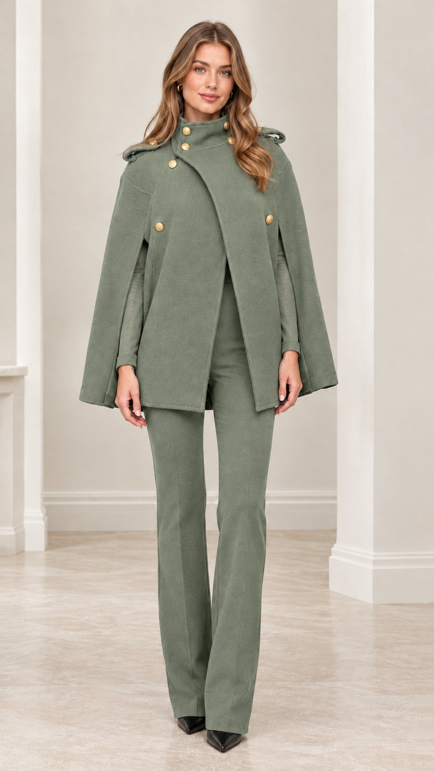 Front view of model wearing sage green military cape coat with matching sage green pants