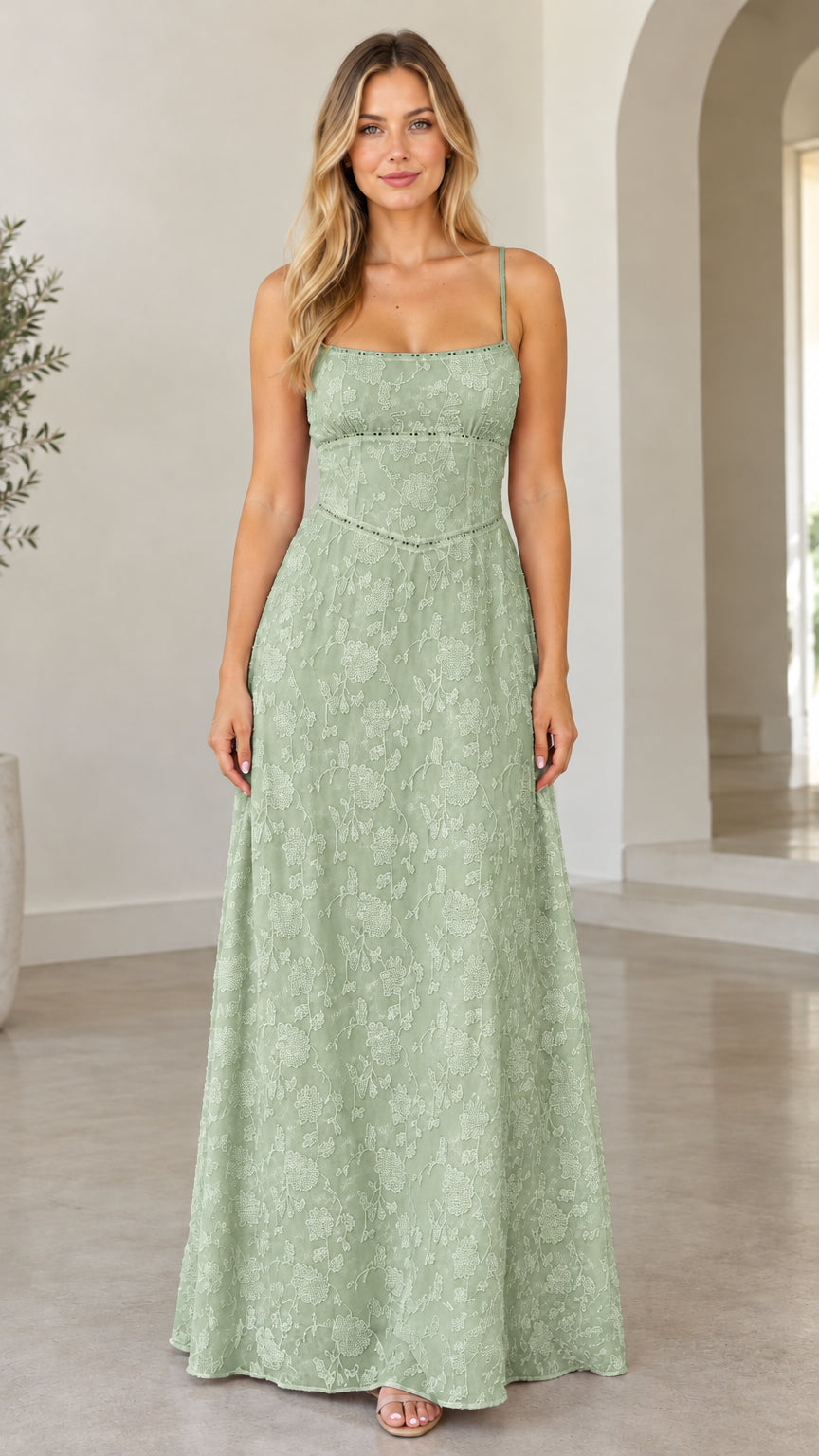 Front view of model wearing sage green floral jacquard tie-back maxi dress
