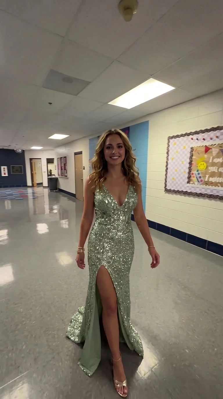 Model wearing sage green sequin plunging V-neck evening gown with slit