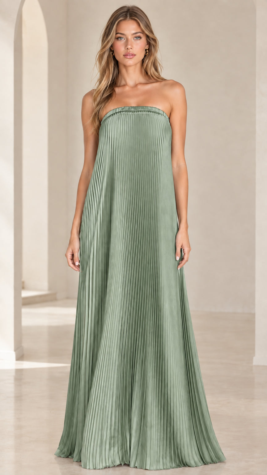 Front view of model wearing a sage green strapless pleated maxi dress