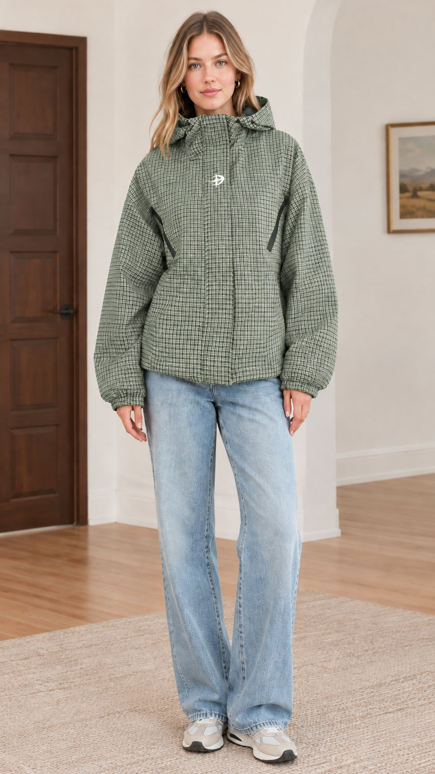 Front view of sage green houndstooth hooded jacket styled with light blue jeans