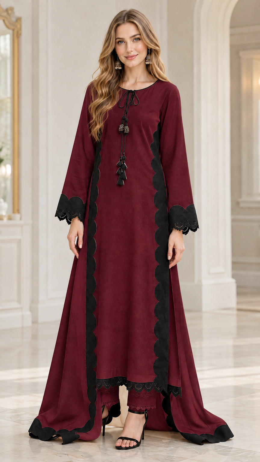 Front view of woman wearing burgundy wine red high-low tunic and trousers set