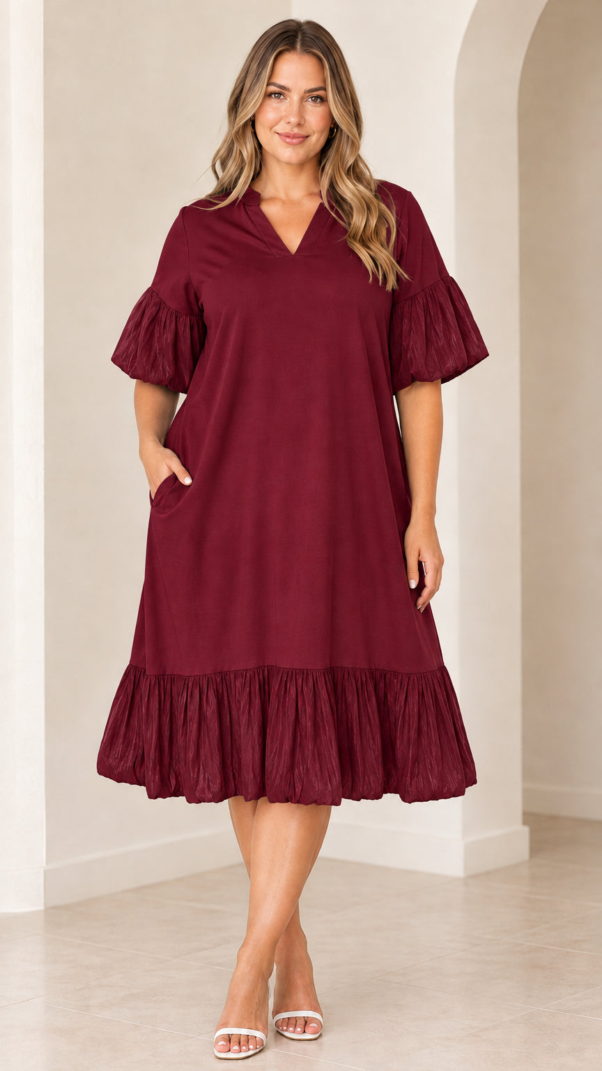 Model wearing burgundy V-neck flutter sleeve midi dress