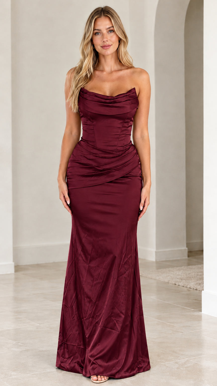 Front view of burgundy red strapless cowl neck corset formal maxi dress